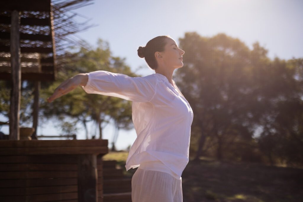 Woman exercising during safari vacation on a sunny day